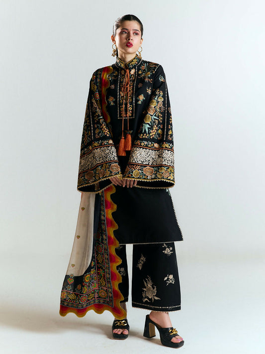 Black cotton shirt with vibrant multicolor Ghara embroidery, matching embroidered culottes, and digitally printed silk dupatta with traditional motifs and playful colors.