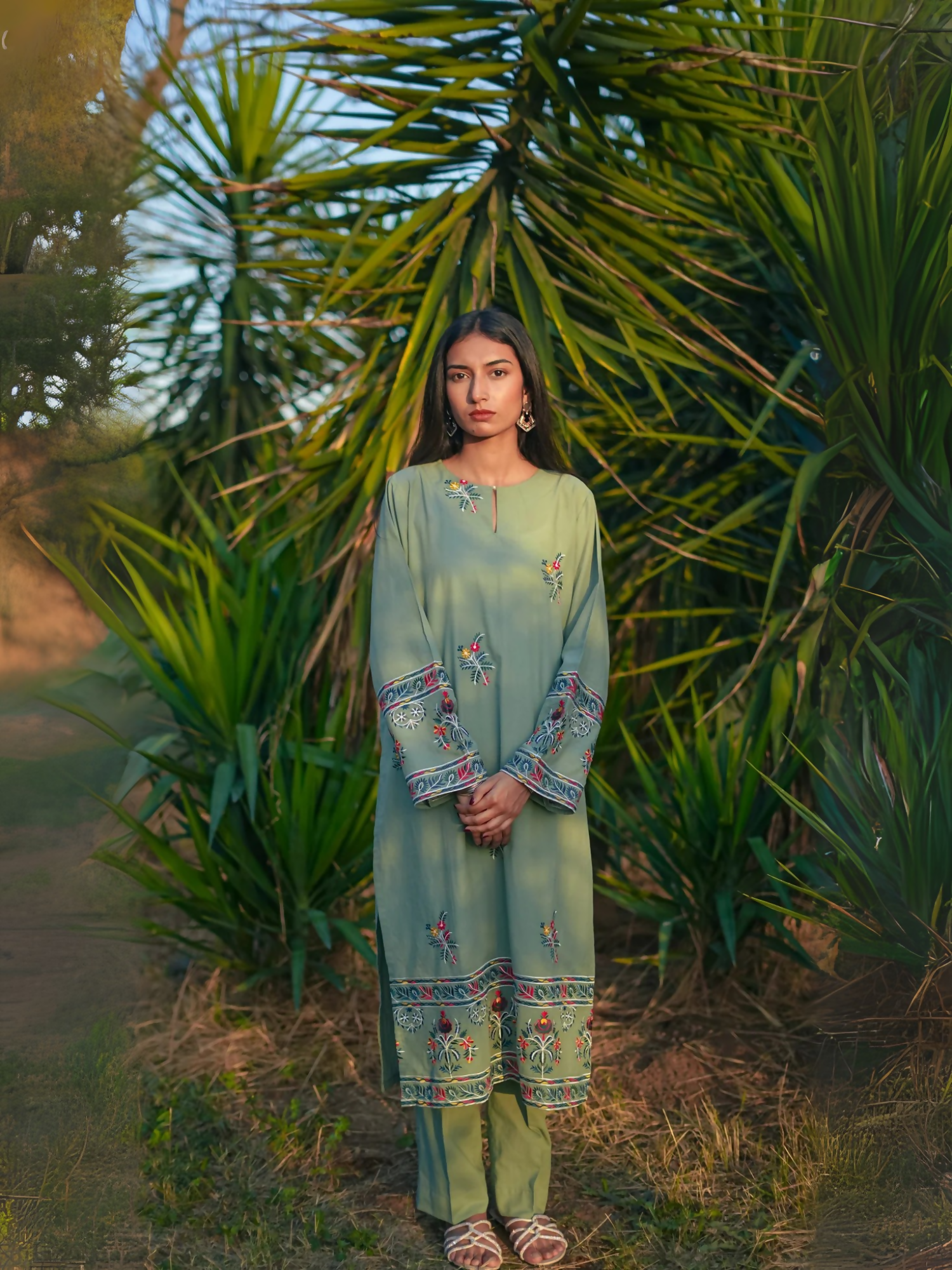 Kachy Dhaagy 2-piece embroidered lawn with intricately detailed embroidered shirt and matching trousers.