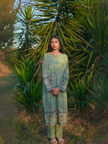 Kachy Dhaagy 2-piece embroidered lawn with intricately detailed embroidered shirt and matching trousers.