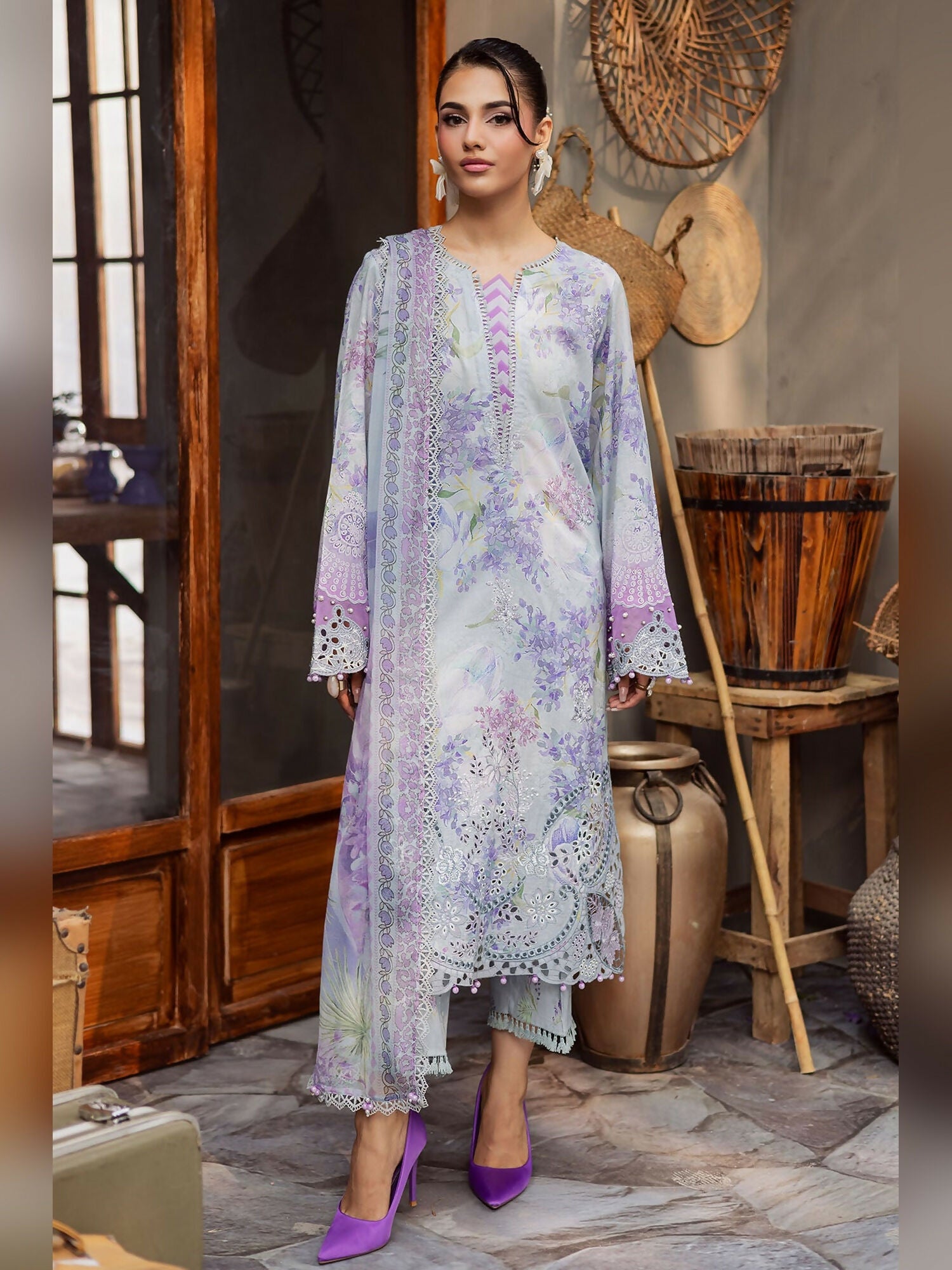 Nureh unstitched 3-piece suit with printed and embroidered chikankari lawn shirt, printed chiffon dupatta, and dyed cotton shalwar.