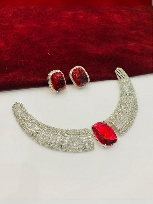 Noor Bilal one carat necklace set with matching studs, available in green, pink, and red center stones with silver detailing.