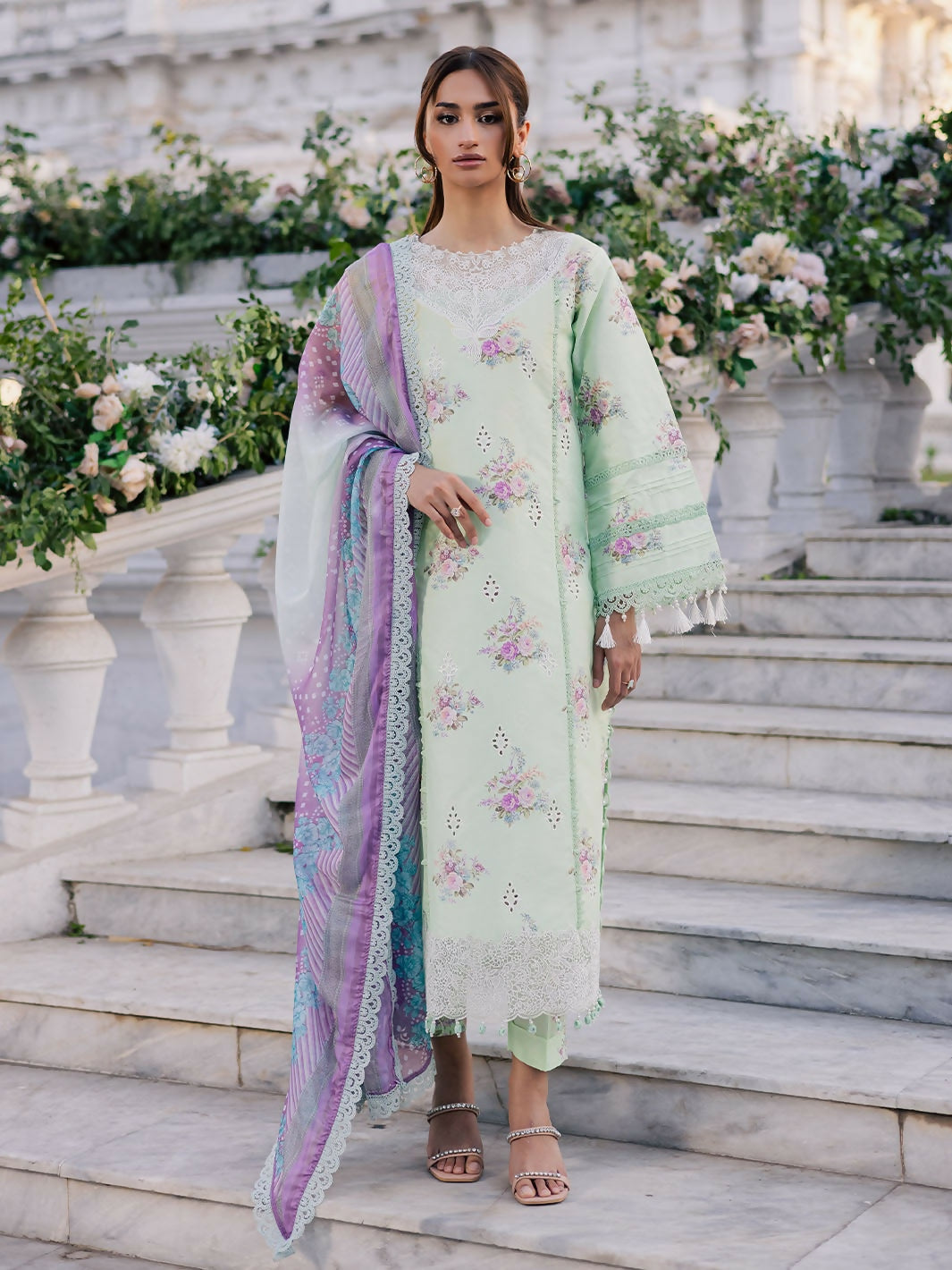 Unstitched 3-piece lawn suit with printed embroidered shirt, chiffon dupatta, and printed cambric trouser.