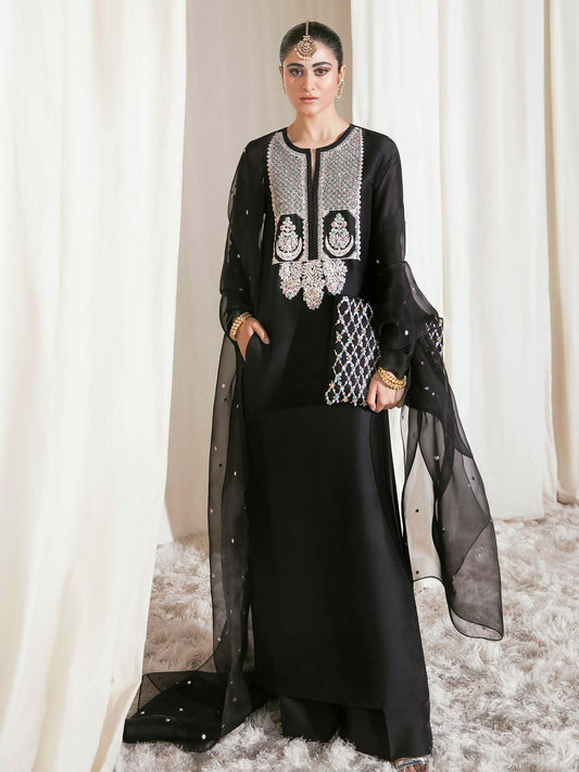 Hussain Rehar raw silk shirt with naqshi, mukesh, and multicolored pipe embellishments, paired with raw silk palazzo pants and sequin-sprayed organza dupatta.