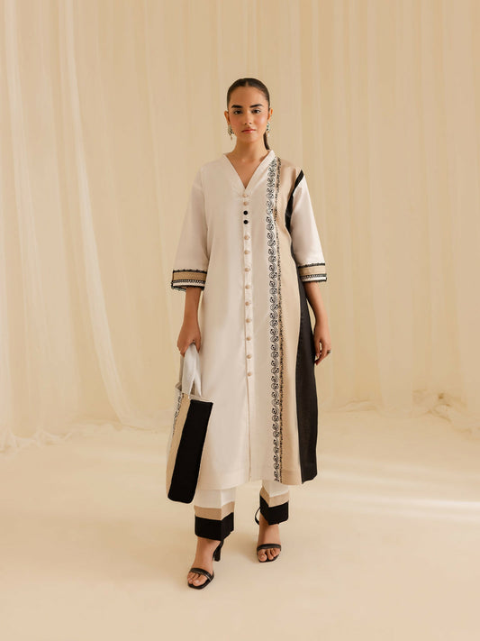 Mahnur stitched 2-piece pret suit featuring a lawn embroidered shirt with classic detailing, paired with a plain trouser.