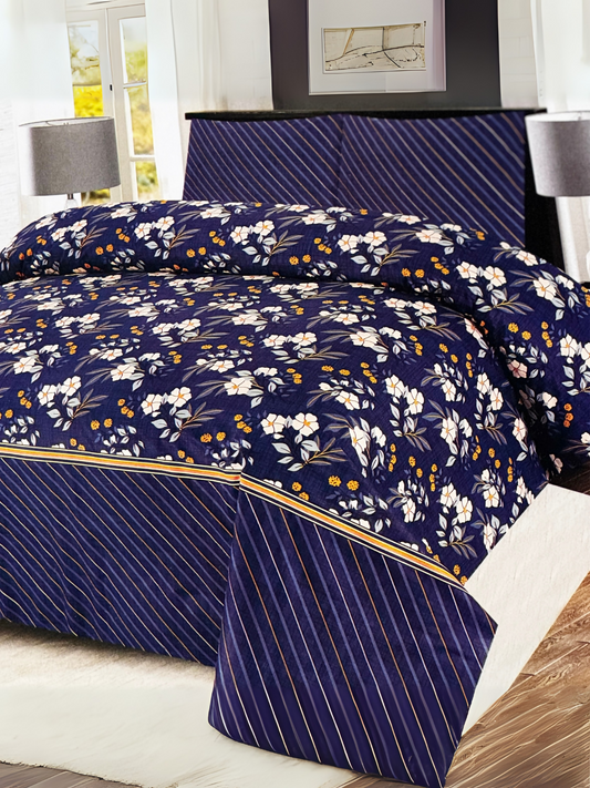Blue 3-piece printed bedspread set featuring large white flowers and small yellow floral accents, styled with matching pillow covers.