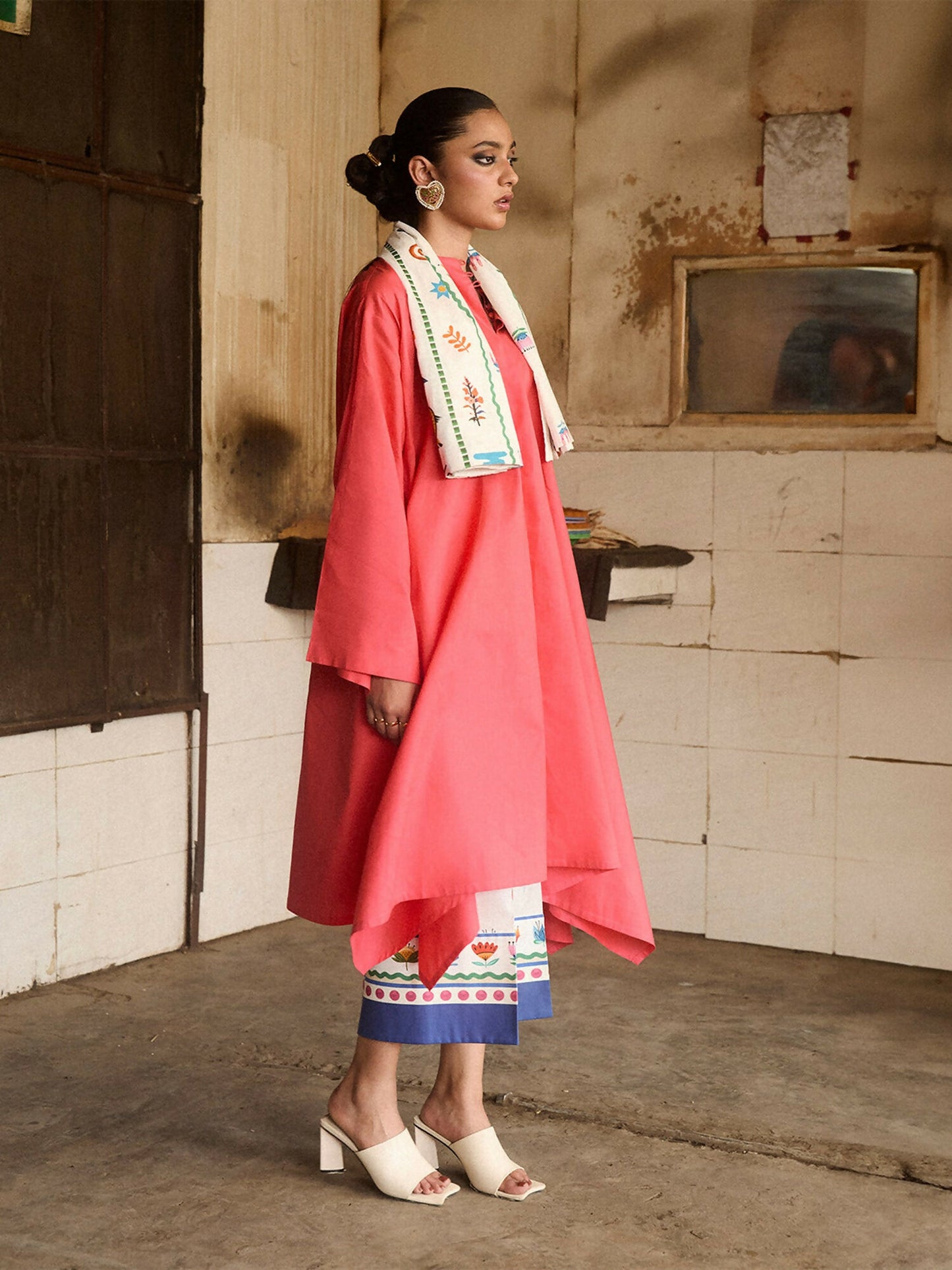 Girl wearing cotton coral shirt with side cascades and ivory printed culottes, stitched 2-piece suit