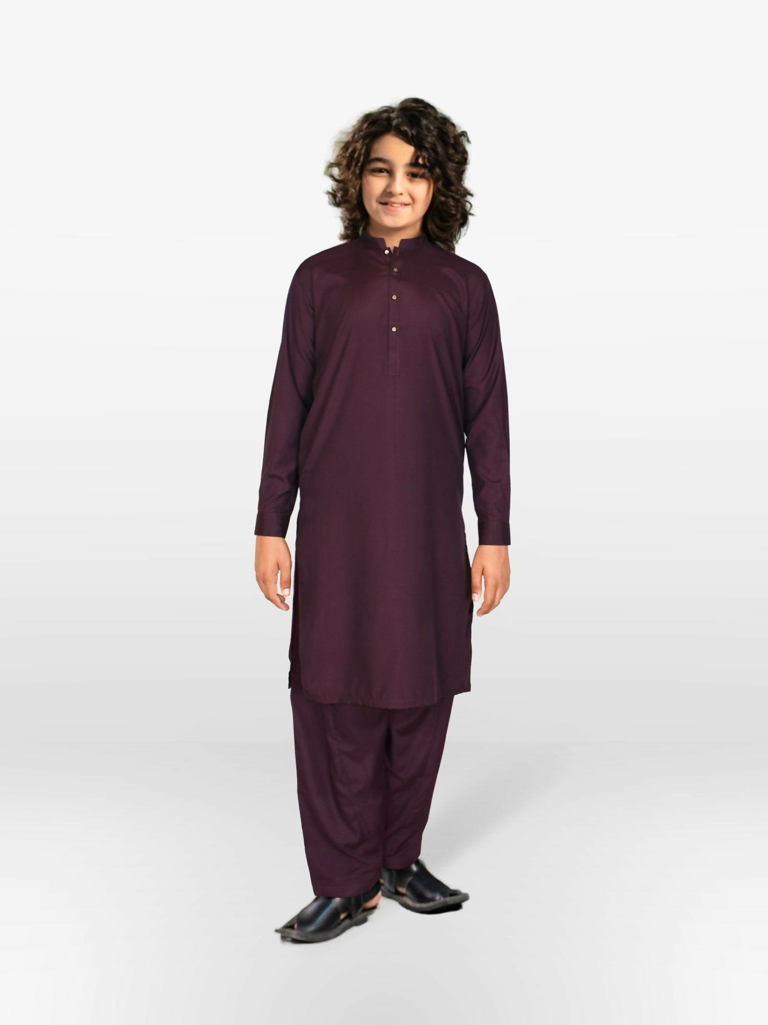 Boy wearing stitched cotton kurta shalwar suit with front button detailing, mandarin collar, full sleeves, and regular fit, ideal for festive and traditional occasions
