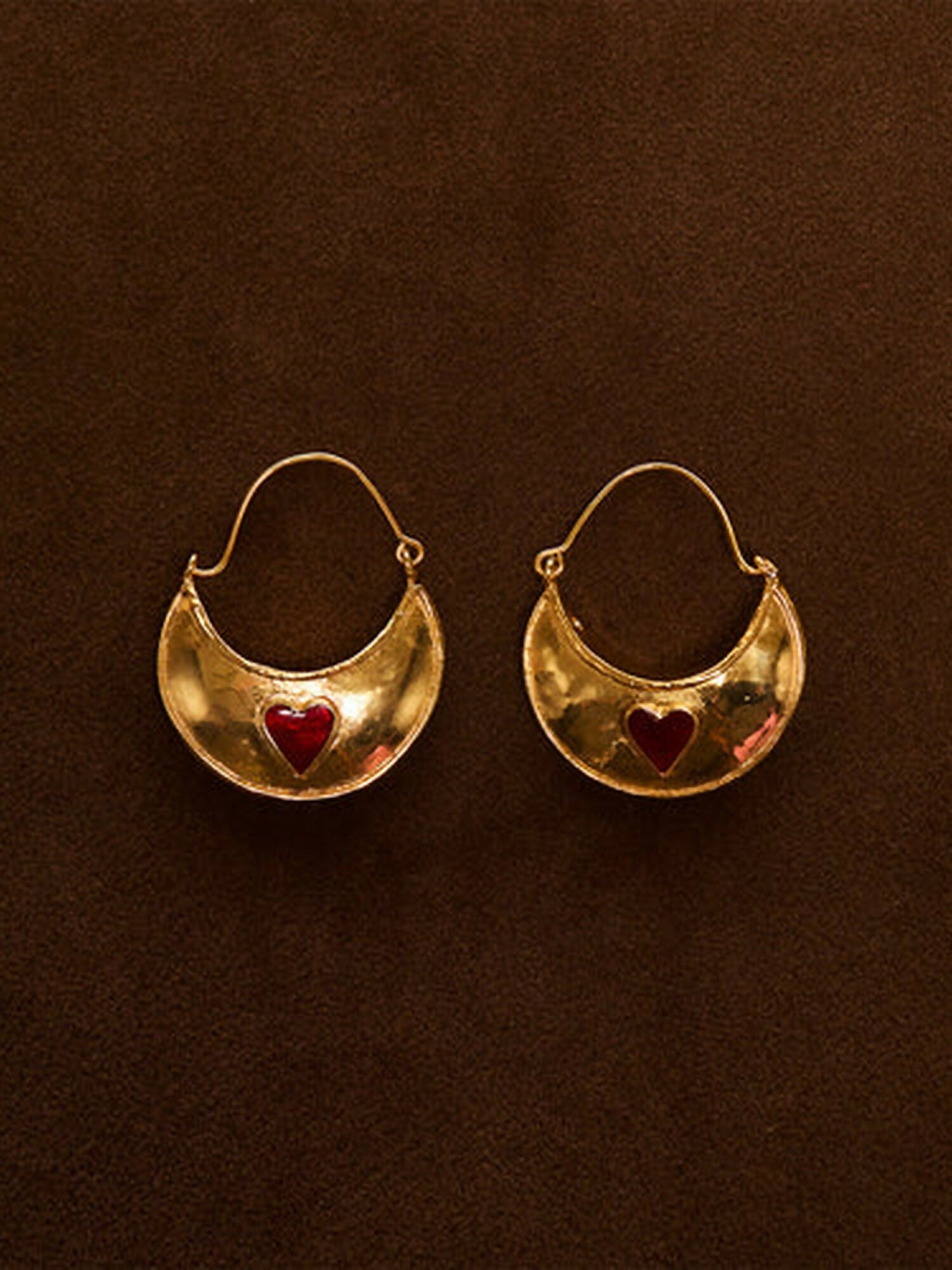 Jugnu by Hussain Rehar Heart Crescent gold earrings with crescent-shaped design, glossy polished finish, and embedded red heart detail, modern romantic accessory.