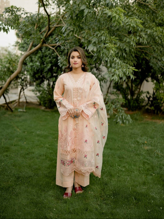 Kachy Dhaagy light peach 3-piece embroidered cotton suit with embroidered shirt, organza dupatta, and plain trouser.