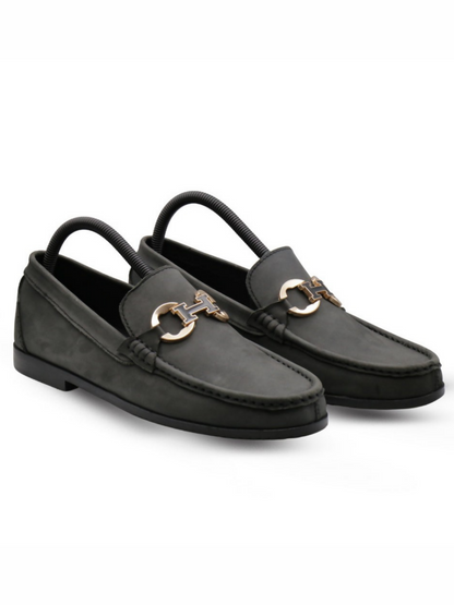 Black textured leather loafers with a sleek silhouette and cushioned insoles, perfect for formal and upscale casual wear.