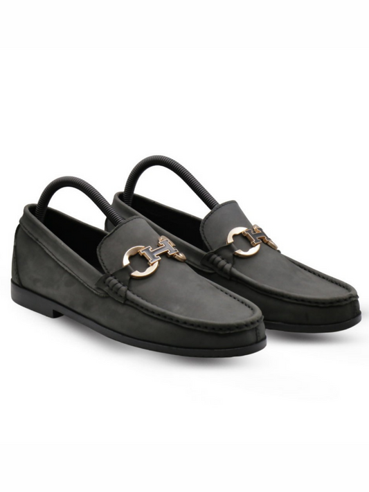Black textured leather loafers with a sleek silhouette and cushioned insoles, perfect for formal and upscale casual wear.