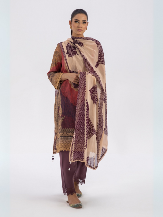Unstitched red and beige 3-piece lawn suit with multicolor printed shirt and dupatta, paired with a dyed cambric trouser.