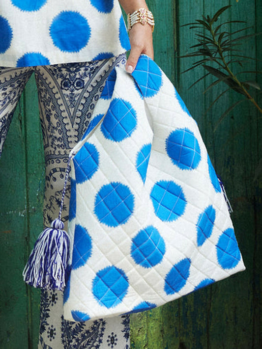 Inkwell quilted ivory bag with blue inky spots by Jugnu by Hussain Rehar.