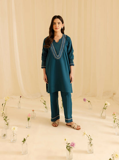 Mahnur stitched 2-piece pret suit featuring a shirt with thread work and fine detailing paired with a trouser with matching craftsmanship.