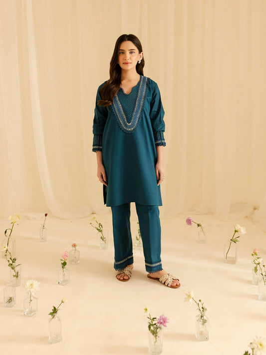 Mahnur stitched 2-piece pret suit featuring a shirt with thread work and fine detailing paired with a trouser with matching craftsmanship.