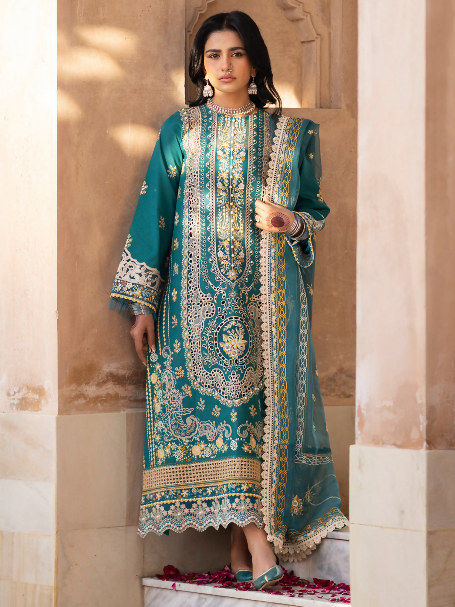 Embroidered lawn shirt with organza details, embroidered net dupatta, and dyed cotton trouser.