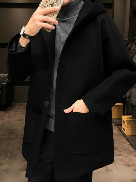 Men’s imported black long woolen coat with attached hood, tailored fit, and sleek modern design