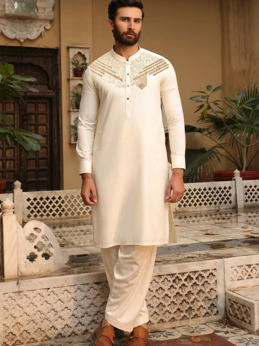 Cream unstitched men’s kameez shalwar by Fabrich from the Monochrome Edit'25 collection, designed with contrast-colored chest neckline embroidery on soft-finish wash n wear fabric.
