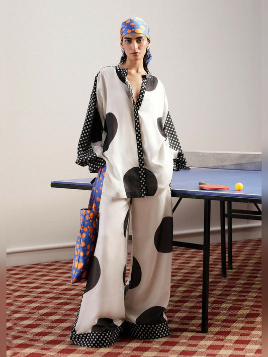 Hussain Rehar white silk matching separate set with black polka dots, shirt featuring smaller polka dot detailing on neckline and sleeves, paired with straight silk pants.