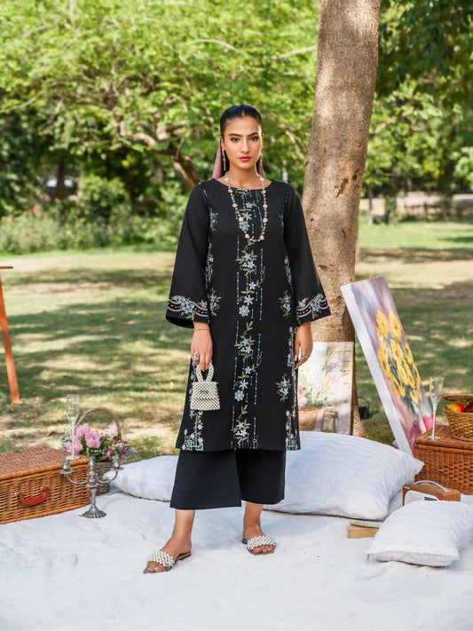 Black stitched two-piece suit with all-over embroidered shirt, including sleeves, paired with culotte trousers by Sehrish Kanwal.