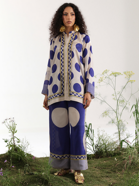 Digital printed silk co-ord set featuring polka dot shirt with geometric borders and trousers with oversized circle motifs.
