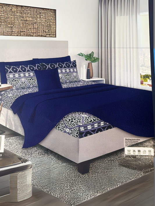 Blue printed 3-piece bedspread set with white and black design, displayed on a king-size bed with matching pillow covers.