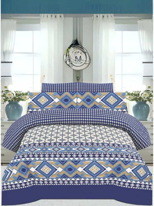 A king size bedsheet with geometric blue, white, and mustard pattern, styled with matching pillow covers on a neatly made bed.