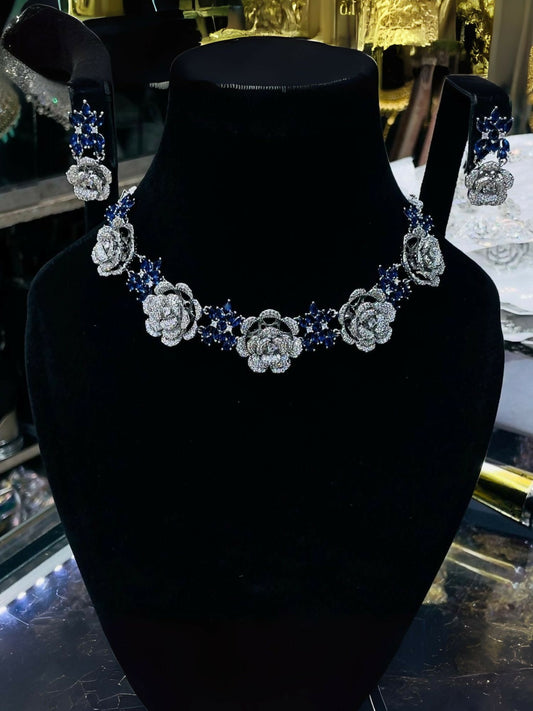 Noor Bilal American diamond necklace set with matching earrings, floral design, and blue crystal accents.