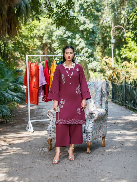 Rich wine stitched two-piece suit with embroidered front and sleeves, cutwork and scallop detailing, paired with straight trousers by Sehrish Kanwal.