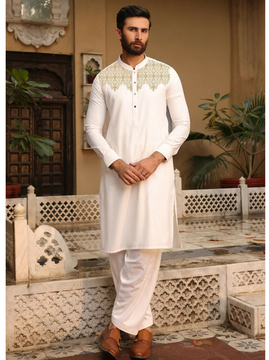 Off-white unstitched men’s kameez shalwar from Fabrich’s Monochrome Edit'25, featuring contrast-colored embroidery on the chest neckline in a signature pattern with soft-finish wash n wear fabric.