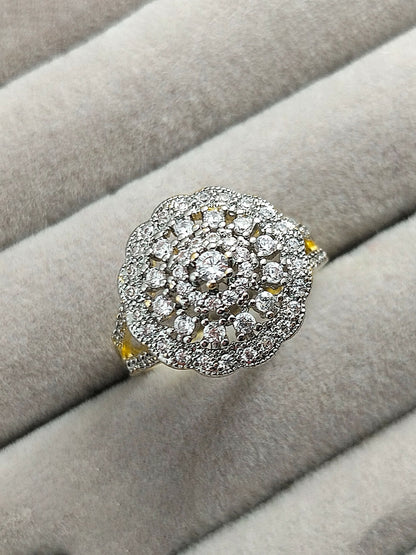 H&A Jewellery 18K gold polished cluster ring with raised center zircon and circular arrangement of small zircon diamonds, elegant gold ring for women