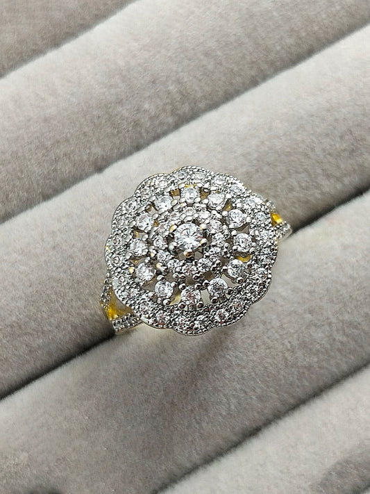 H&A Jewellery 18K gold polished cluster ring with raised center zircon and circular arrangement of small zircon diamonds, elegant gold ring for women