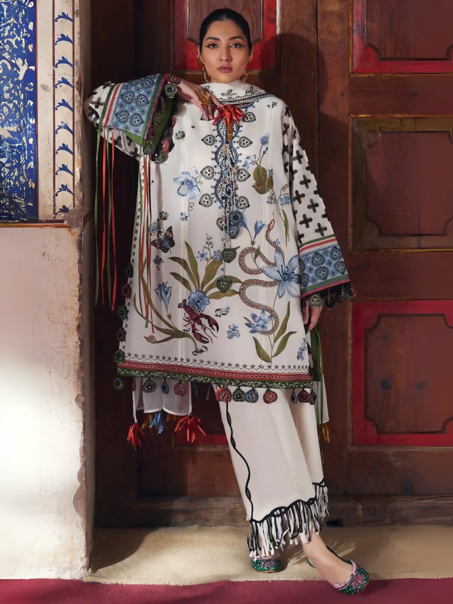 Unstitched 3-piece suit by Elan with embroidered lawn shirt, khaddi net embroidered dupatta, and cambric trouser