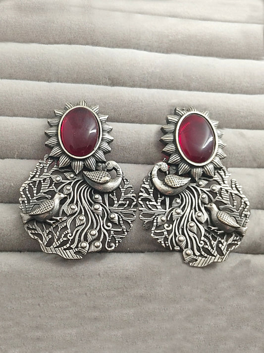 H&A Jewellery silver peacock motif earrings with red stone and sunburst design