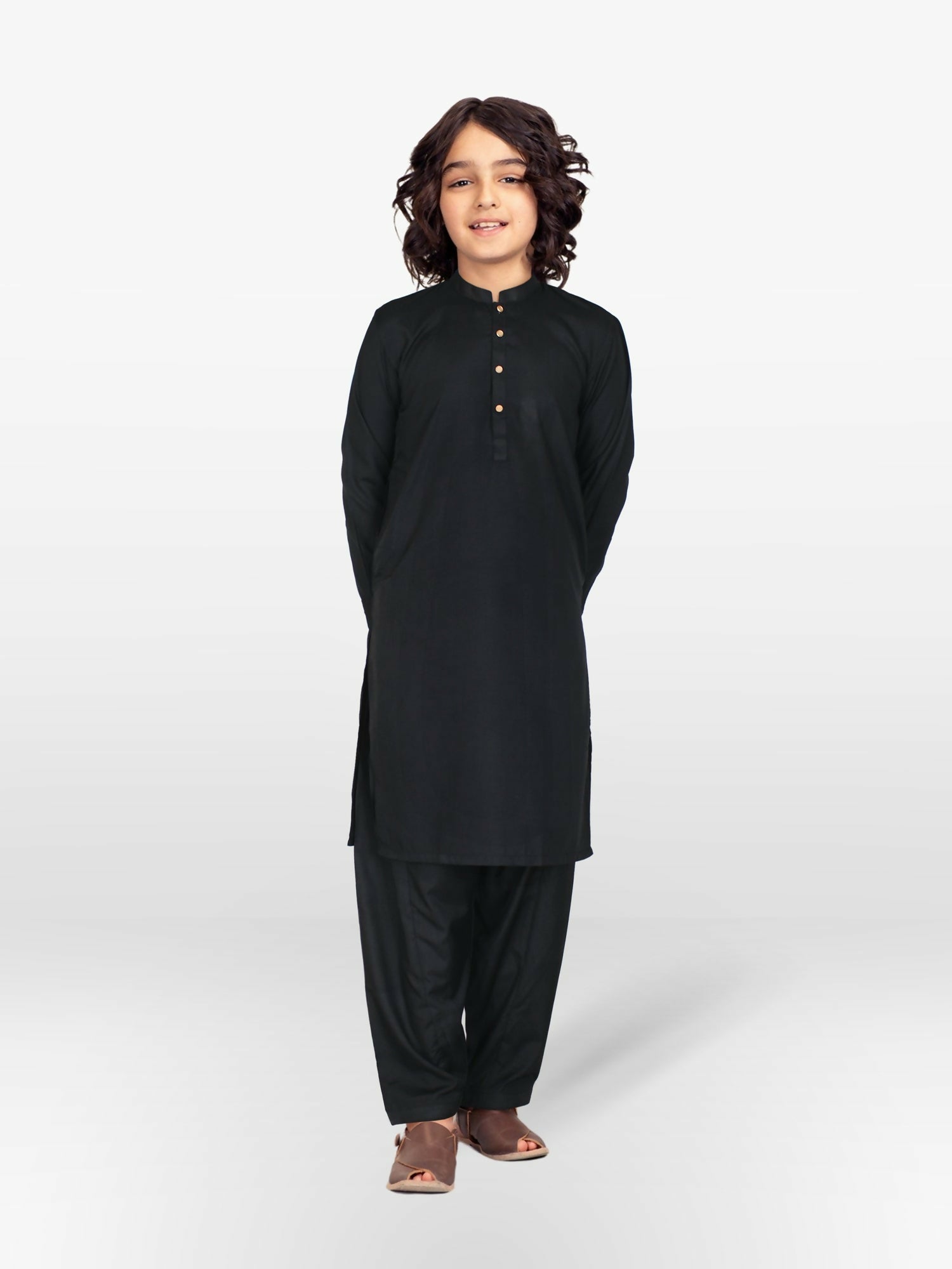 Boy wearing stitched cotton kurta shalwar suit with front buttons, mandarin collar, full sleeves, and regular fit, ideal for traditional and festive occasions