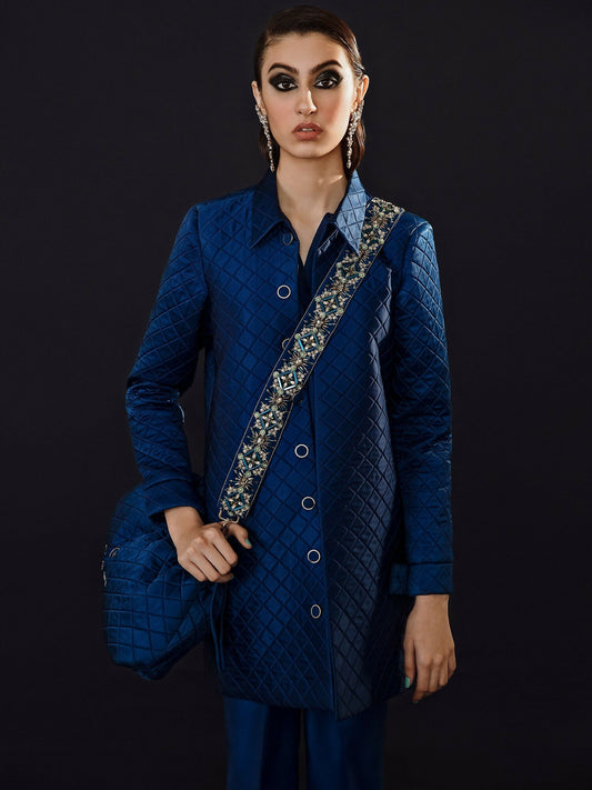 White long organza jacket outfit with silver embellishments, straight pants, and organza dupatta by Hussain Rehar.