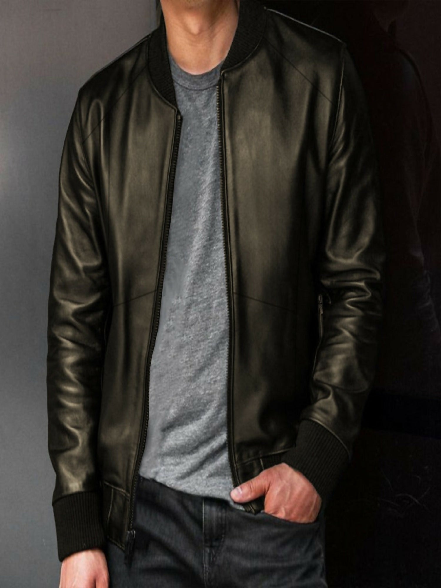Man wearing a Luxe PU leather bomber jacket with soft velvet lining and classic bomber design, perfect for a sleek and sophisticated look