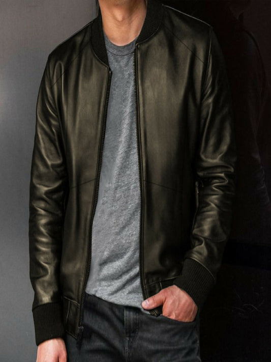 Man wearing a Luxe PU leather bomber jacket with soft velvet lining and classic bomber design, perfect for a sleek and sophisticated look