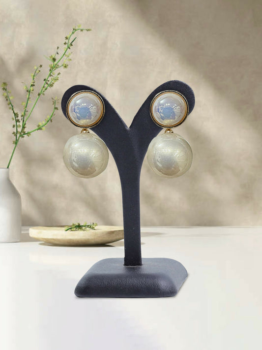Glitter Jewellery pearl drop earrings with a glossy finish, displayed on a black stand.