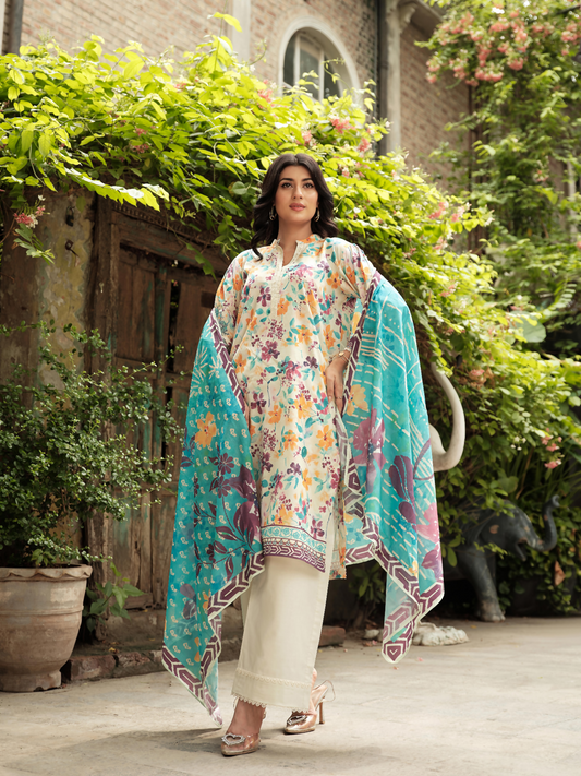 Unstitched 3-piece suit featuring a floral digital printed lawn shirt in ivory base, vibrant digital printed blue-toned dupatta, and a plain cream dyed trouser.