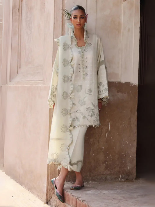Unstitched 3-piece suit by Elan with embroidered self-jacquard appliqué shirt, voile dupatta with lotus appliqués, and dyed cambric trouser.