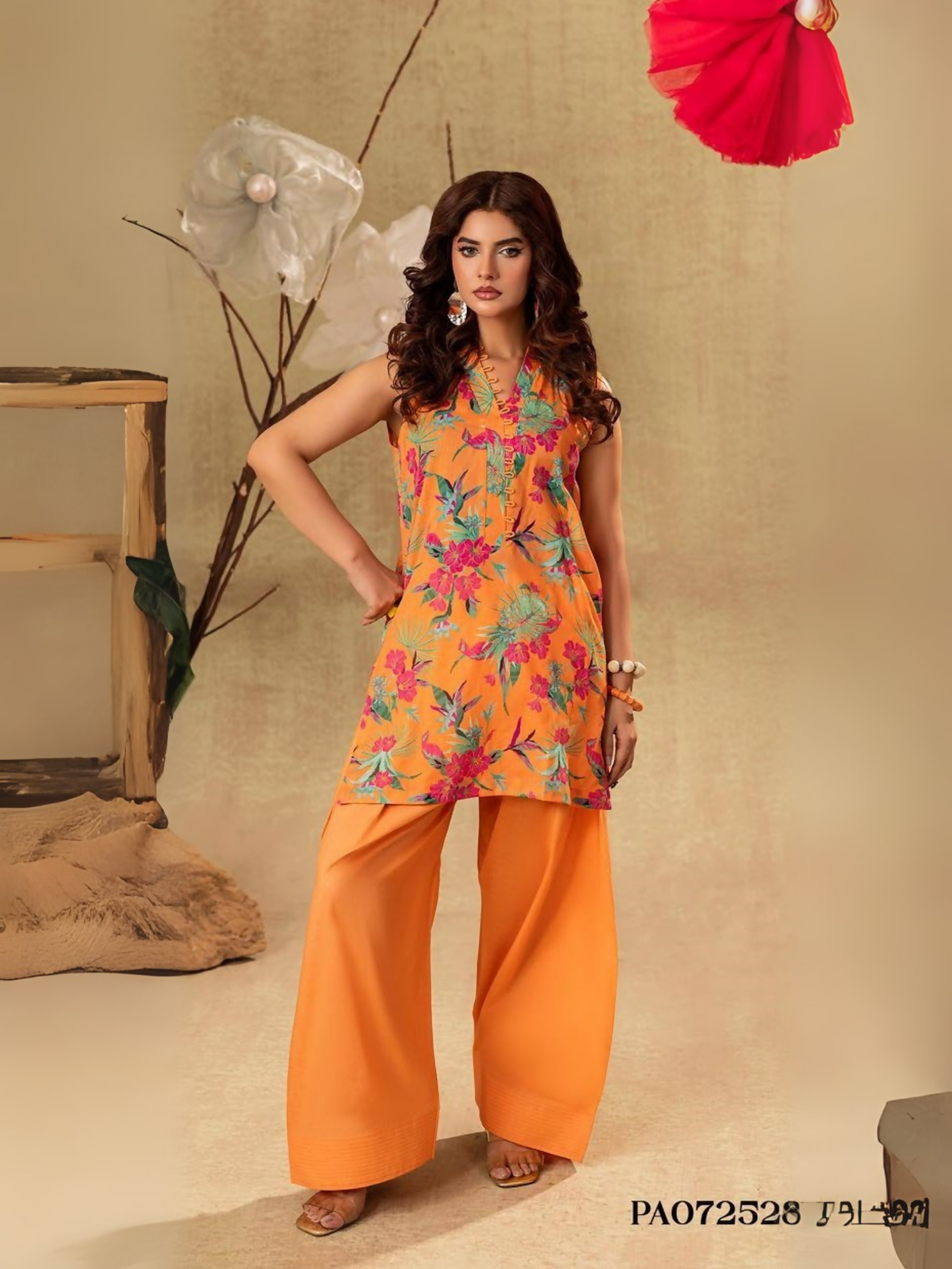 Unstitched 2-piece suit with orange floral printed shirt and plain dyed orange trouser, perfect for casual wear.