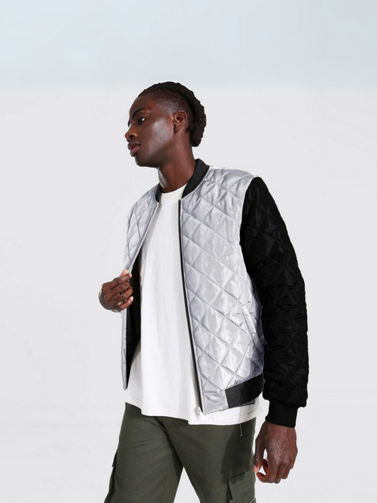 Jupiter puffer bomber jacket for men, featuring fleece sleeves, ribbed cuffs and bottom, block pattern stitching, and front zip closure. Made with polyester body, cotton-blend rib, and fleece sleeves for warmth and comfort.