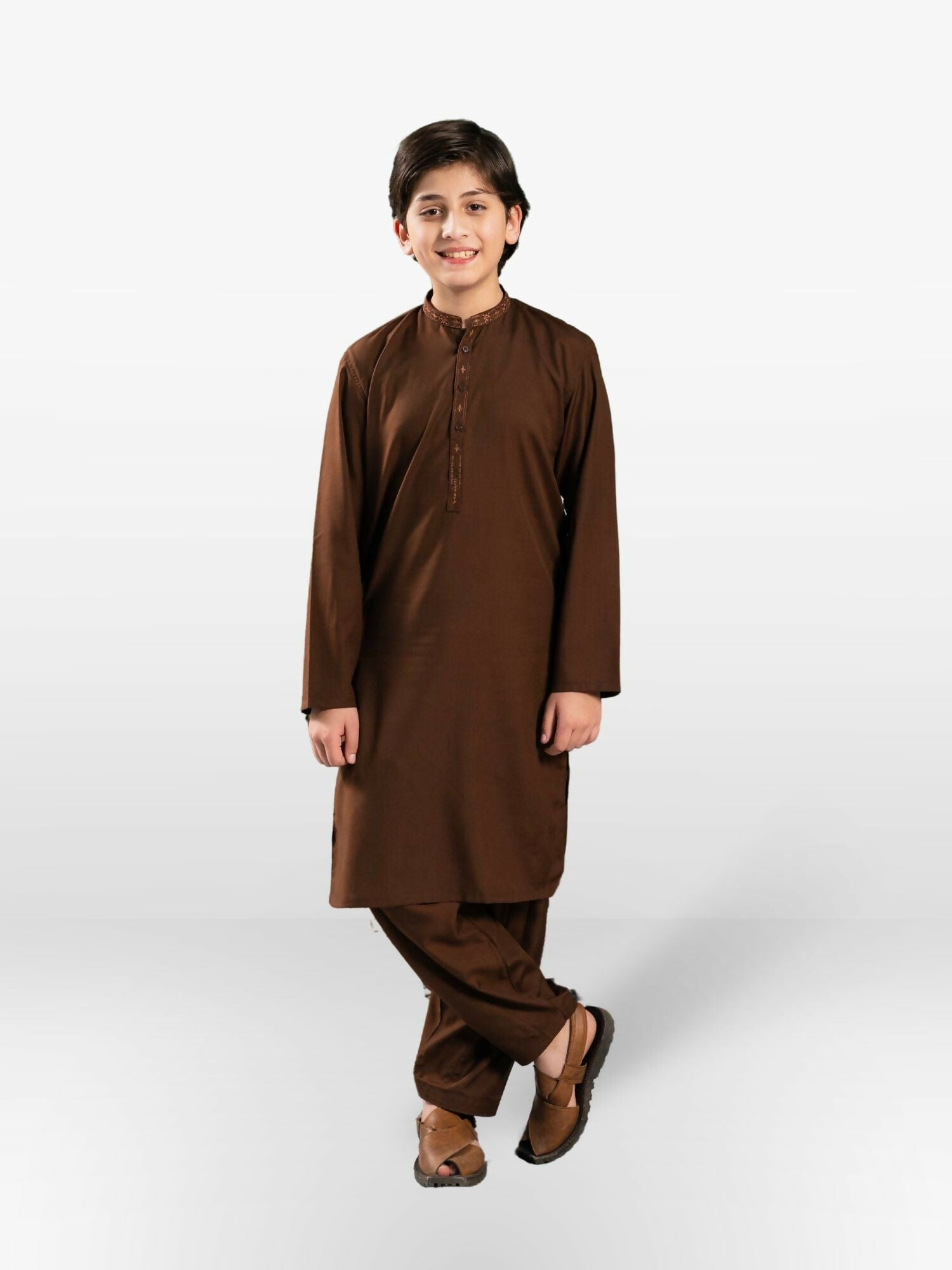 Boy wearing embroidered stitched shalwar kameez with mandarin collar, full sleeves, and regular fit, ideal for festive and cultural occasions