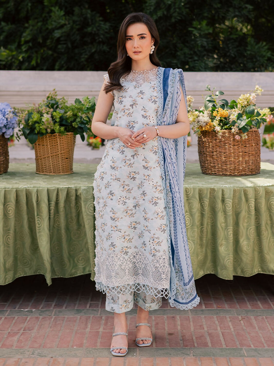 Unstitched 3-piece lawn suit with printed embroidered shirt, printed silk dupatta, and printed cambric trouser.