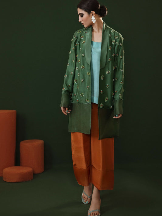 Moss green hand-embellished raw silk jacket with rust culottes and turquoise slip by Hussain Rehar.