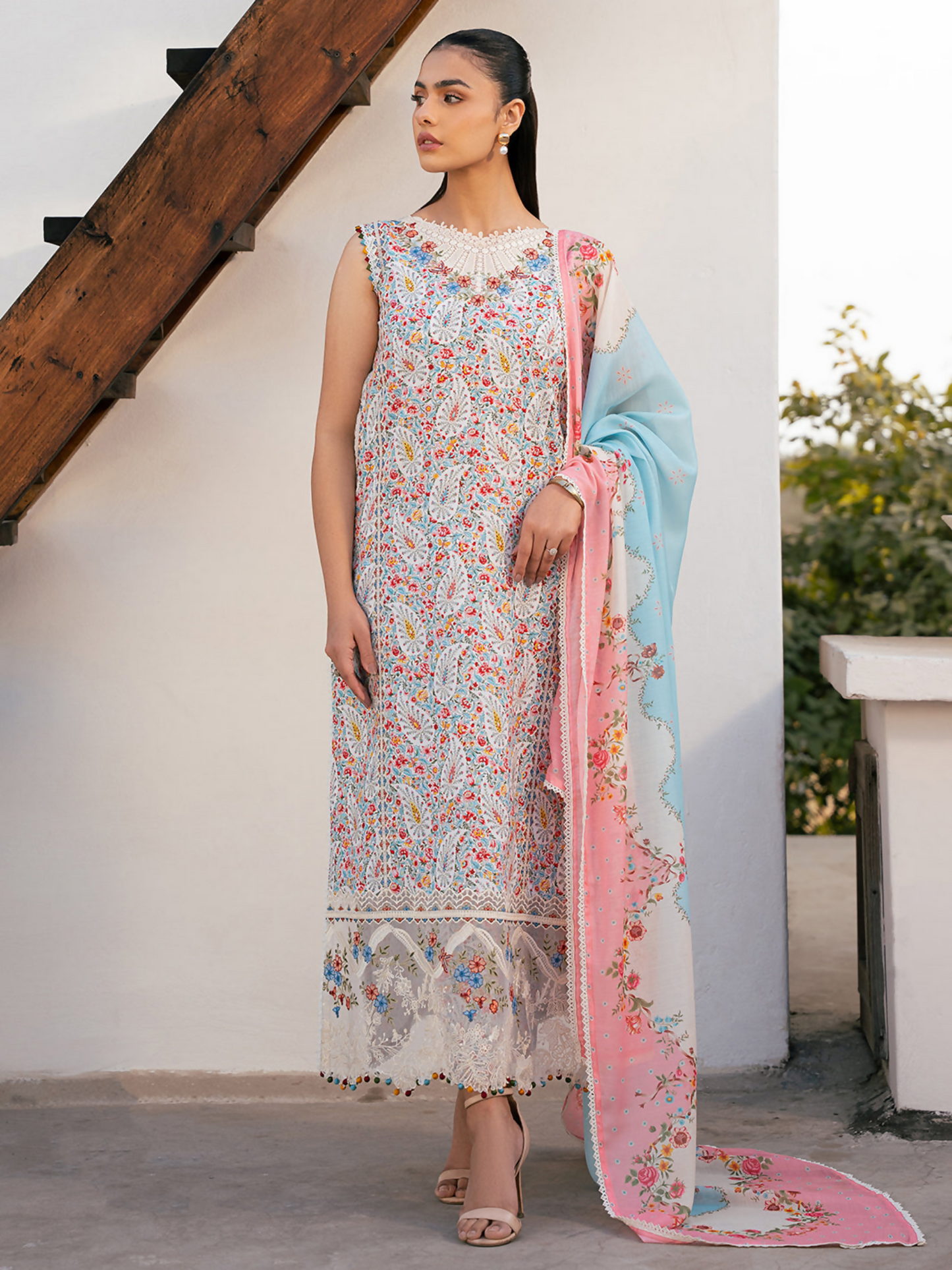 Digital printed lawn suit with embroidered organza pocket accents and silk dupatta.