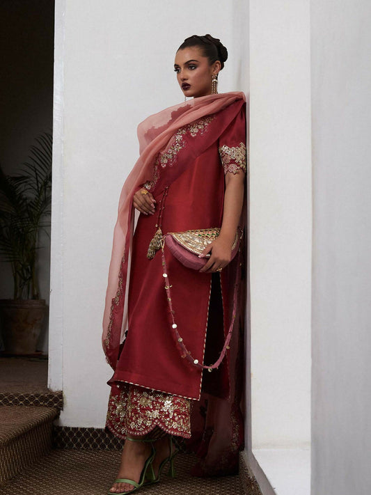 Hussain Rehar salmon pink raw silk long shirt with cut-work neckline and sleeves, hand-embellished culottes, and contrasting scalloped organza dupatta with salmon finishing