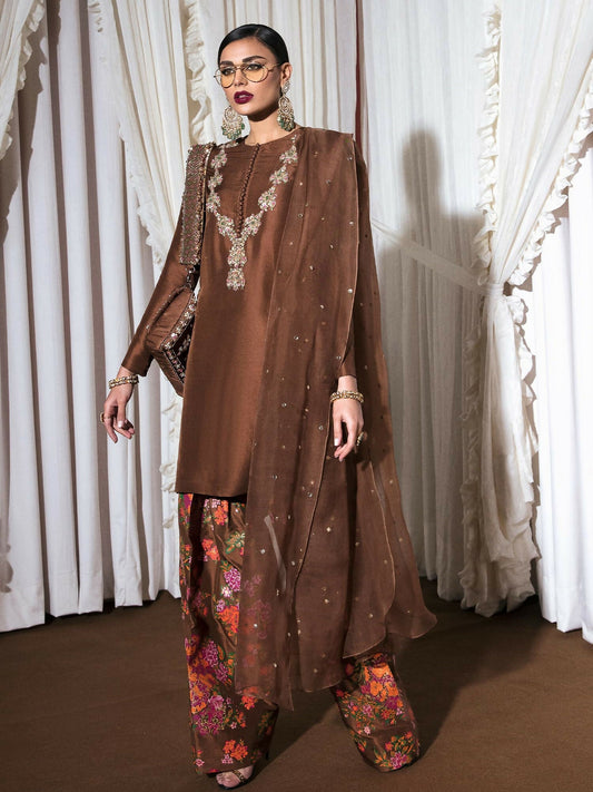 Brown raw silk stitched 3-piece suit Sorel by HussainRehar featuring an embellished shirt with nakshi, dabka, sequins, mukaish, multicolor bugle beads, and loop buttons, paired with a printed raw silk shalwar and an organza dupatta sprayed with gold sequins