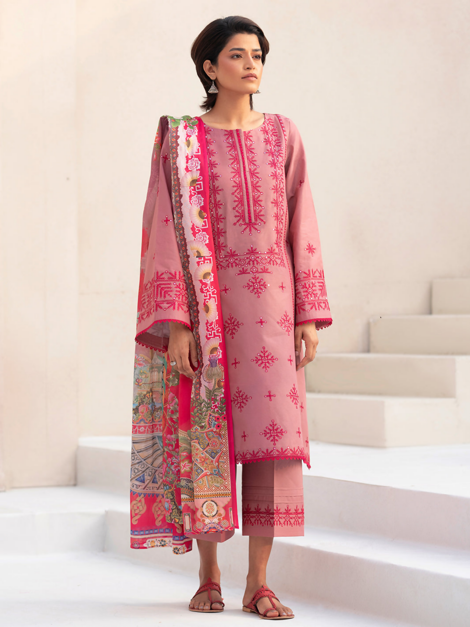 Midnight-toned embroidered lawn shirt with sequin detailing, paired with a vibrant digitally printed silk dupatta and plain dyed cotton trouser.